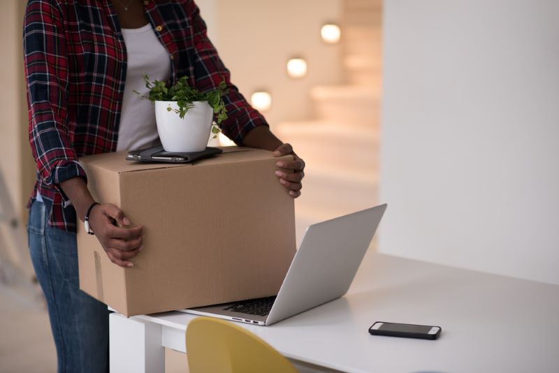 woman dividing property and moving out of house