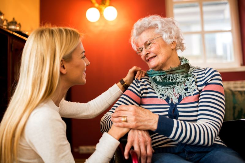woman taking care of her elderly mother