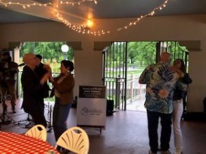 a group of people dancing in a room
