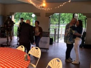 a group of people standing around a table