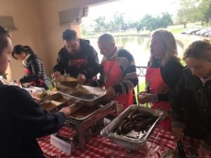 a group of people cooking food
