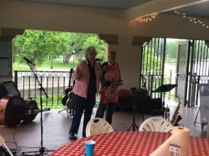 a couple of people standing on a porch