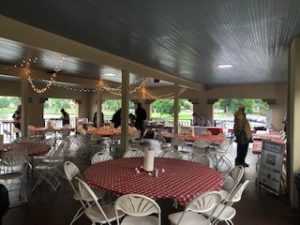 a group of people around tables