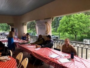 a group of people sitting at tables